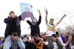 A demonstrator holds a poster of Abdullah Ocalan, the leader of the Kurdish armed organization Kurdistan Workers' Party (PKK), during the Newruz celebration. Tens of thousands gather at the Newroz Square in Diyarbakir, the largest Kurdish-majority city during the final celebration of the Newroz holiday. The massive crowd celebrated with great enthusiasm, marking the occasion with vibrant festivities. This celebration is observed by the Kurdish people in Turkey across 89 locations this year.