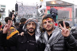 Two Kurdish teenagers are seen making victory signs during the Newruz celebration. Tens of thousands gather at the Newroz Square in Diyarbakir, the largest Kurdish-majority city during the final celebration of the Newroz holiday. The massive crowd celebrated with great enthusiasm, marking the occasion with vibrant festivities. This celebration is observed by the Kurdish people in Turkey across 89 locations this year.