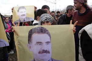 A demonstrator holds a poster of Abdullah Ocalan, the leader of the Kurdish armed organization Kurdistan Workers' Party (PKK), during the Newruz celebration. Tens of thousands gather at the Newroz Square in Diyarbakir, the largest Kurdish-majority city during the final celebration of the Newroz holiday. The massive crowd celebrated with great enthusiasm, marking the occasion with vibrant festivities. This celebration is observed by the Kurdish people in Turkey across 89 locations this year.