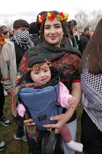 A Kurdish woman is seen attending the Newruz celebration with her baby. Tens of thousands gather at the Newroz Square in Diyarbakir, the largest Kurdish-majority city during the final celebration of the Newroz holiday. The massive crowd celebrated with great enthusiasm, marking the occasion with vibrant festivities. This celebration is observed by the Kurdish people in Turkey across 89 locations this year.