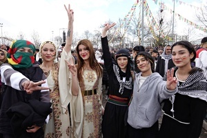 Kurdish young girls are seen making victory signs during the Newruz celebration. Tens of thousands gather at the Newroz Square in Diyarbakir, the largest Kurdish-majority city during the final celebration of the Newroz holiday. The massive crowd celebrated with great enthusiasm, marking the occasion with vibrant festivities. This celebration is observed by the Kurdish people in Turkey across 89 locations this year.