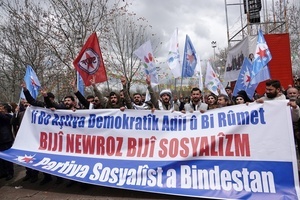 Members of the Socialist Party of the Oppressed (ESP) are seen attending the Newruz celebration. Tens of thousands gather at the Newroz Square in Diyarbakir, the largest Kurdish-majority city during the final celebration of the Newroz holiday. The massive crowd celebrated with great enthusiasm, marking the occasion with vibrant festivities. This celebration is observed by the Kurdish people in Turkey across 89 locations this year.