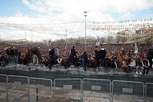 Participants seen during the Newruz celebration. Tens of thousands gather at the Newroz Square in Diyarbakir, the largest Kurdish-majority city during the final celebration of the Newroz holiday. The massive crowd celebrated with great enthusiasm, marking the occasion with vibrant festivities. This celebration is observed by the Kurdish people in Turkey across 89 locations this year.