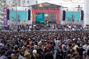 Participants seen during the Newruz celebration. Tens of thousands gather at the Newroz Square in Diyarbakir, the largest Kurdish-majority city during the final celebration of the Newroz holiday. The massive crowd celebrated with great enthusiasm, marking the occasion with vibrant festivities. This celebration is observed by the Kurdish people in Turkey across 89 locations this year.
