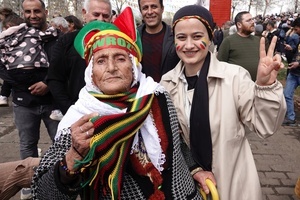 An elderly woman is seen attending the Newruz celebration. Tens of thousands gather at the Newroz Square in Diyarbakir, the largest Kurdish-majority city during the final celebration of the Newroz holiday. The massive crowd celebrated with great enthusiasm, marking the occasion with vibrant festivities. This celebration is observed by the Kurdish people in Turkey across 89 locations this year.