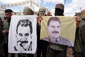 A demonstrator holds a poster of Abdullah Ocalan, the leader of the Kurdish armed organization Kurdistan Workers' Party (PKK), during the Newruz celebration. Tens of thousands gather at the Newroz Square in Diyarbakir, the largest Kurdish-majority city during the final celebration of the Newroz holiday. The massive crowd celebrated with great enthusiasm, marking the occasion with vibrant festivities. This celebration is observed by the Kurdish people in Turkey across 89 locations this year.