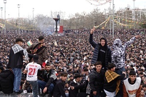 Demonstrators are seen making victory signs during the Newruz celebration. Tens of thousands gather at the Newroz Square in Diyarbakir, the largest Kurdish-majority city during the final celebration of the Newroz holiday. The massive crowd celebrated with great enthusiasm, marking the occasion with vibrant festivities. This celebration is observed by the Kurdish people in Turkey across 89 locations this year.