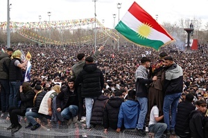 A demonstrator waving the Kurdistan flag is seen during the Newruz celebration. Tens of thousands gather at the Newroz Square in Diyarbakir, the largest Kurdish-majority city during the final celebration of the Newroz holiday. The massive crowd celebrated with great enthusiasm, marking the occasion with vibrant festivities. This celebration is observed by the Kurdish people in Turkey across 89 locations this year.
