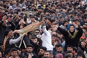 Demonstrators are seen making victory signs and dancing during the Newruz celebration. Tens of thousands gather at the Newroz Square in Diyarbakir, the largest Kurdish-majority city during the final celebration of the Newroz holiday. The massive crowd celebrated with great enthusiasm, marking the occasion with vibrant festivities. This celebration is observed by the Kurdish people in Turkey across 89 locations this year.