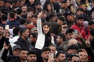 A Kurdish girl making a victory sign is seen during the Newruz celebration. Tens of thousands gather at the Newroz Square in Diyarbakir, the largest Kurdish-majority city during the final celebration of the Newroz holiday. The massive crowd celebrated with great enthusiasm, marking the occasion with vibrant festivities. This celebration is observed by the Kurdish people in Turkey across 89 locations this year.