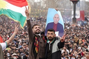 A demonstrator holds a poster of Abdullah Ocalan, the leader of the Kurdish armed organization Kurdistan Workers' Party (PKK), at the Newruz celebration. Tens of thousands gather at the Newroz Square in Diyarbakir, the largest Kurdish-majority city during the final celebration of the Newroz holiday. The massive crowd celebrated with great enthusiasm, marking the occasion with vibrant festivities. This celebration is observed by the Kurdish people in Turkey across 89 locations this year.