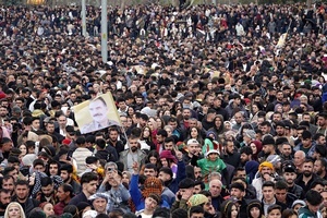 Participants seen during the Newruz celebration. Tens of thousands gather at the Newroz Square in Diyarbakir, the largest Kurdish-majority city during the final celebration of the Newroz holiday. The massive crowd celebrated with great enthusiasm, marking the occasion with vibrant festivities. This celebration is observed by the Kurdish people in Turkey across 89 locations this year.
