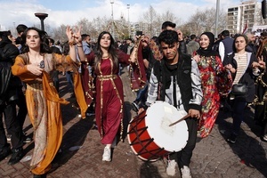 Kurdish women are seen dancing during the Newruz celebration. Tens of thousands gather at the Newroz Square in Diyarbakir, the largest Kurdish-majority city during the final celebration of the Newroz holiday. The massive crowd celebrated with great enthusiasm, marking the occasion with vibrant festivities. This celebration is observed by the Kurdish people in Turkey across 89 locations this year.
