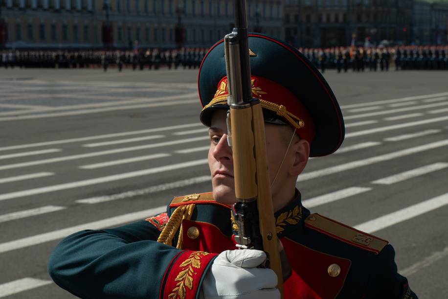 A Russian serviceman marches on Palace Square during the Victory Day parade. Victory Day parade at Palace Square to commemorate the 80th anniversary of the Soviet Union's victory over Nazi Germany in World War II. The parade featured over 5,500 military personnel, including St. Petersburg garrison troops, emergency services, cadets, and a unique unit of Cossacks honoring their historical role in defending Leningrad. More than 90 units of military equipment were displayed, and veterans were invited, with around 400 receiving invitations. Access to Palace Square was by invitation only, but spectators could watch from areas like the Alexander Garden and Palace Embankment. The event coincided with a massive Immortal Regiment march along Nevsky Prospekt, with approximately one million participants carrying portraits of WWII relatives.