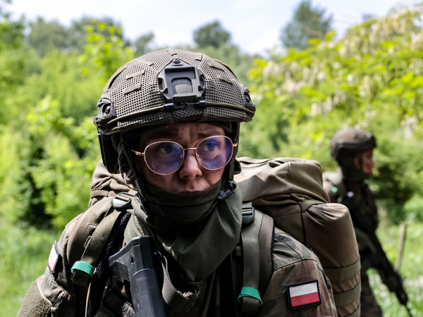 Candidates for Territorial Defence soldiers seen marching in a defensive formation take exams after finishing 16 days ''Tactical Loop'' training in Pasternik Garrison Training Center (GOSz). Successful candidates after taking the oath will join the 11th Lesser Poland Territorial Defense Brigade. Territorial Defence army is an organization that trains civilians who voluntarily wish to acquire military and defence skills. Volunteers from various parts of Lesser Poland who have not had any contact with military service before acquire the basics of military craft. They learned among other skills, the construction and operation of military equipment, the basics of shooting, tactics, topography, rules of conduct on the battlefield and survival and providing first aid on the battlefield.