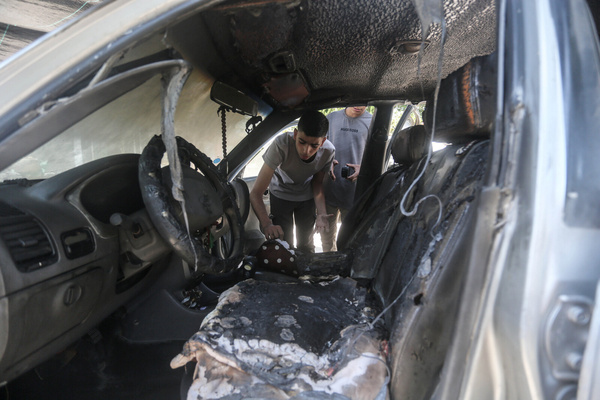 A Palestinian inspects a burned-out car set alight by Jewish settlers during an attack on the town of Bruqin, near the northern West Bank city of Salfit. Groups of Jewish settlers attacked and burned Palestinian homes and vehicles in the town of Bruqin, in the northern West Bank. Local residents reported that hundreds of Jewish settlers burned property, planted Israeli flags, and seized surrounding land in the town. This came after an Israeli settler was shot dead by a Palestinian near the Bruqin settlement.
