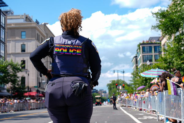 A Metropolitan Police officer stands on the route of the WorldPride Parade. Washington hosted WorldPride 2025 and faced challenges due to President Trump's anti-trans policies, which included boycotts from some countries.