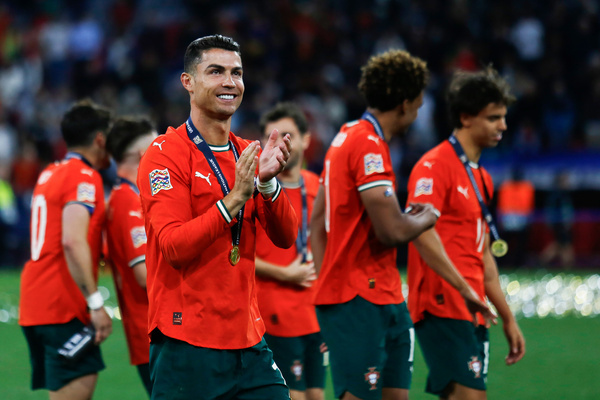 Portugal's Cristiano Ronaldo walks across the pitch with the gold medal after the award ceremony. Portugal 2–2 Spain (Portugal win 5–3 on penalties)