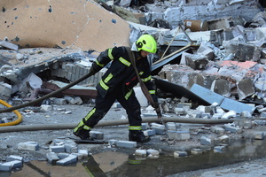 Firefighters work at the site of a Russian drone strike amidst Russia's attack. Russia carried out "massive" drone attacks on Ukraine's capital and port city of Odesa killing one person and hitting a maternity hospital, Ukrainian officials said, and called for further sanctions.