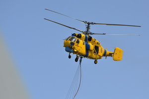 A firefighting helicopter flies near the site of a Russian drone strike amidst Russia's attack. Russia carried out "massive" drone attacks on Ukraine's capital and port city of Odesa killing one person and hitting a maternity hospital, Ukrainian officials said, and called for further sanctions.