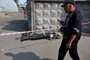 A man walks past the wreckage of a Shahed-136 near a building hit by a Russian drone amidst Russia's attack. Russia carried out "massive" drone attacks on Ukraine's capital and port city of Odesa killing one person and hitting a maternity hospital, Ukrainian officials said, and called for further sanctions.