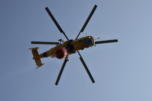 A firefighting helicopter flies near the site of a Russian drone strike amidst Russia's attack. Russia carried out "massive" drone attacks on Ukraine's capital and port city of Odesa killing one person and hitting a maternity hospital, Ukrainian officials said, and called for further sanctions.