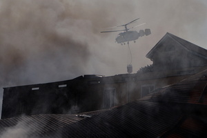A firefighting helicopter flies near the site of a Russian drone strike amidst Russia's attack. Russia carried out "massive" drone attacks on Ukraine's capital and port city of Odesa killing one person and hitting a maternity hospital, Ukrainian officials said, and called for further sanctions.