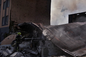 Firefighters work at the site of a Russian drone strike amidst Russia's attack. Russia carried out "massive" drone attacks on Ukraine's capital and port city of Odesa killing one person and hitting a maternity hospital, Ukrainian officials said calling for further sanctions.