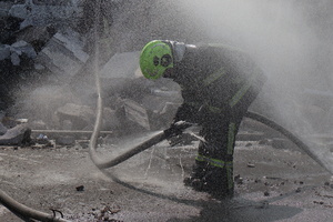 Firefighters work at the site of a Russian drone strike amid Russia's attack. Russia carried out "massive" drone attacks on Ukraine's capital and port city of Odesa killing one person and hitting a maternity hospital, Ukrainian officials said calling for further sanctions.
