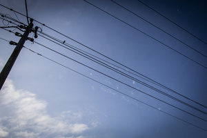 A bird sits on a wire as Israeli air defense intercept Iranian ballistic missiles in the sky over central Israel. An Iranian missile struck the main hospital in southern Israel early Thursday, causing extensive damage and wounding several people, though none seriously, according to the hospital. Other missiles hit a high-rise apartment building in Ramat Gan, and additional sites in central Israel, leaving at least 240 wounded and four of them seriously according to Israel's Health Ministry.