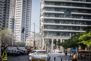 A view of a building after an Iranian ballistic missile strike. An Iranian missile struck the main hospital in southern Israel early Thursday, causing extensive damage and wounding several people, though none seriously, according to the hospital. Other missiles hit a high-rise apartment building in Ramat Gan, and additional sites in central Israel, leaving at least 240 wounded and four of them seriously according to Israel's Health Ministry.