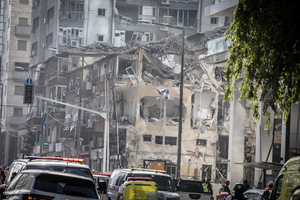 A view of a building that was hit in an Iranian ballistic missile strike. An Iranian missile struck the main hospital in southern Israel early Thursday, causing extensive damage and wounding several people, though none seriously, according to the hospital. Other missiles hit a high-rise apartment building in Ramat Gan, and additional sites in central Israel, leaving at least 240 wounded and four of them seriously according to Israel's Health Ministry.