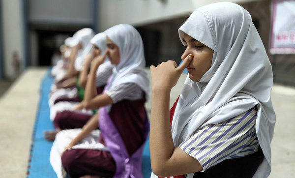 Students from N.H English Academy school participate in a yoga session conducted on the occasion of International Yoga day. Practising regular yoga exercise from a very young age yields significant benefits in reducing stress and anxiety promoting physical health and mental well being which in turn brings joy, happiness and peace of mind.
