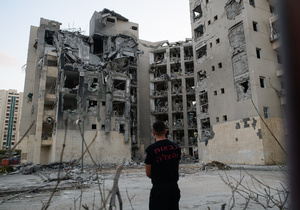 A fire fighter inspects a residential building in Be’er Sheva destroyed by an Iranian ballistic missile, in which four Israelis were killed.