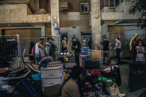 Residents collect their belongings near a residential building in Be’er Sheva destroyed by an Iranian ballistic missile, in which four Israelis were killed.
