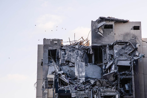 Birds fly over a residential building in Beíer Sheva destroyed by an Iranian ballistic missile, in which four Israelis were killed.