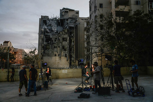 Foreign and Israeli press broadcasters seen near a residential building in Beíer Sheva destroyed by an Iranian ballistic missile, in which four Israelis were killed.