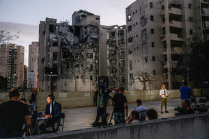 Foreign and Israeli press broadcasters seen near a residential building in Beíer Sheva destroyed by an Iranian ballistic missile, in which four Israelis were killed.