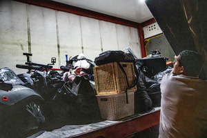 A truck full of evacuated belongings from damaged houses next to a residential building in Beíer Sheva destroyed by an Iranian ballistic missile, in which four Israelis were killed.