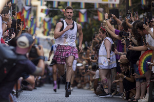 A competitor in heels seen in action, during the High Heel Race on Pelayo Street. The 26th edition of the High Heel Race was held in the LGBTQ+ neighborhood of Chueca, a sporting and festive event that involves running in heels.