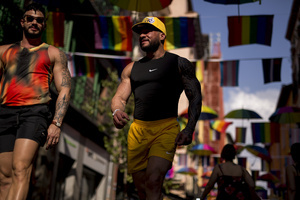 Two people walk down a street where umbrellas in the colors of the LGBTQ+ flag are hanging during the High Heel Race on Pelayo Street. The 26th edition of the High Heel Race was held in the LGBTQ+ neighborhood of Chueca, a sporting and festive event that involves running in heels.