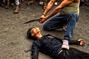 A stunt with knife and Sword is performed during Ashura, the 10th day of Muharram in the Islamic calendar. Muharram is the first month of the Islamic calendar & Ashura is the tenth day of the month of Muharram, which commemorates the martyrdom of Imam Hussain, the grandson of Prophet Muhammad (PBUH), during the battle of Karbala. It is part of Mourning for Shia Muslims and a day of fasting for Sunni Muslims that is observed all over the World.
