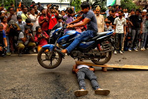 A stunt bike during Ashura, the 10th day of Muharram in the Islamic calendar. Muharram is the first month of the Islamic calendar & Ashura is the tenth day of the month of Muharram, which commemorates the martyrdom of Imam Hussain, the grandson of Prophet Muhammad (PBUH), during the battle of Karbala. It is part of Mourning for Shia Muslims and a day of fasting for Sunni Muslims that is observed all over the World.