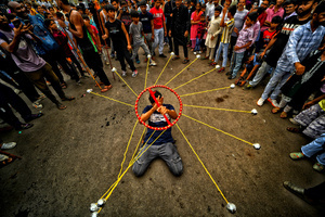 A participant performs with 'Gatka', an ancient form of martial arts, during a religious procession of Ashura, the 10th day of Muharram in the Islamic calendar. Muharram is the first month of the Islamic calendar & Ashura is the tenth day of the month of Muharram, which commemorates the martyrdom of Imam Hussain, the grandson of Prophet Muhammad (PBUH), during the battle of Karbala. It is part of Mourning for Shia Muslims and a day of fasting for Sunni Muslims that is observed all over the World.
