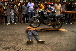 A stunt bike during Ashura, the 10th day of Muharram in the Islamic calendar. Muharram is the first month of the Islamic calendar & Ashura is the tenth day of the month of Muharram, which commemorates the martyrdom of Imam Hussain, the grandson of Prophet Muhammad (PBUH), during the battle of Karbala. It is part of Mourning for Shia Muslims and a day of fasting for Sunni Muslims that is observed all over the World.