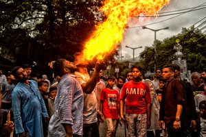 A stunt with fire during Ashura, the 10th day of Muharram in the Islamic calendar. Muharram is the first month of the Islamic calendar & Ashura is the tenth day of the month of Muharram, which commemorates the martyrdom of Imam Hussain, the grandson of Prophet Muhammad (PBUH), during the battle of Karbala. It is part of Mourning for Shia Muslims and a day of fasting for Sunni Muslims that is observed all over the World.