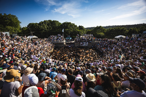 People watch as aloitadores hold a wild horses during the celebration of the Rapa das Bestas. “A Rapa Das Bestas" is an ancient Galician festival (dating back to the 15th century) held in the first days of July. It consists of capturing wild horses, leading them to a curro (enclosed enclosure) and cutting their manes to deworm and care for them. It is a ritual of strength and a tradition that symbolizes the coexistence between man and nature celebrated primarily in Sabucedo.