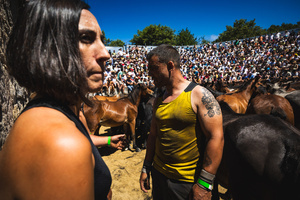 Aloidadores rest during the Rapa das Bestas celebration. “A Rapa Das Bestas" is an ancient Galician festival (dating back to the 15th century) held in the first days of July. It consists of capturing wild horses in the wild, leading them to a curro (enclosed enclosure) and cutting their manes to deworm and care for them. It is a ritual of strength and tradition that symbolizes the coexistence between man and nature celebrated primarily in Sabucedo.