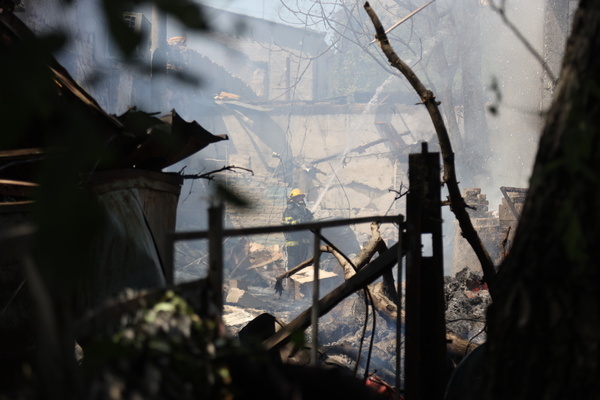 A firefighter extinguishes fire after drone attack in Moldovanka district of Odessa. Russia attacked Odessa with strike drones. The head of the Odessa Regional State Administration, Oleh Oleksandrovych Kiper said that nine people were injured as a result of the attack, and seven were hospitalized. In the area of the impact, windows of private houses were damaged and service station, cars damaged by debris.