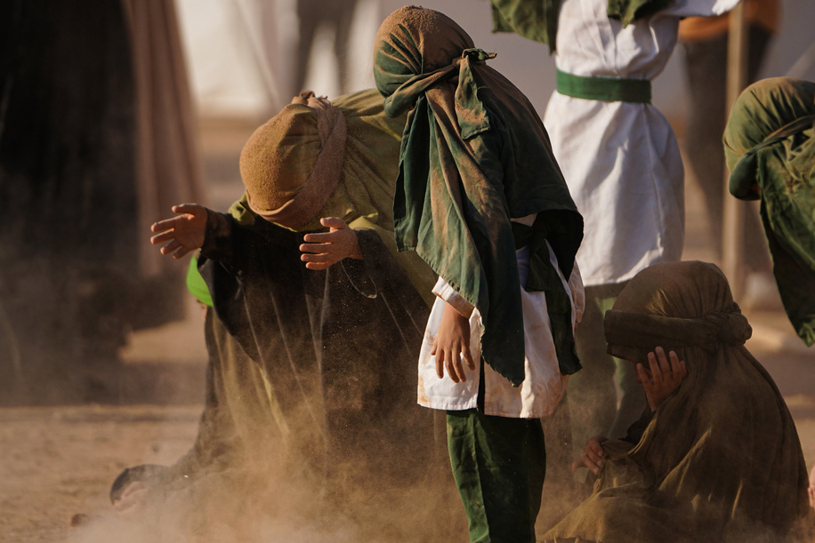 Shiite Muslim re-enactors play of the 7th century AD battle of Karbala coinciding with 10 Muharram according to the Islamic calendar commemorating the martyrdom of Prophet Mohammad's grandson Imam Hussein in Iraq's northern district of Bartella outskirts of Mosul, on the day of Ashura.